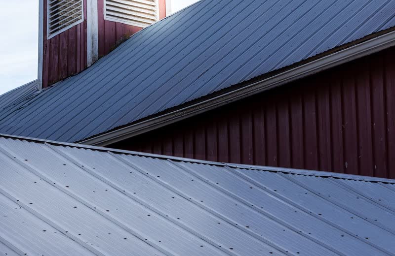 Dark standing-seam metal roof panels