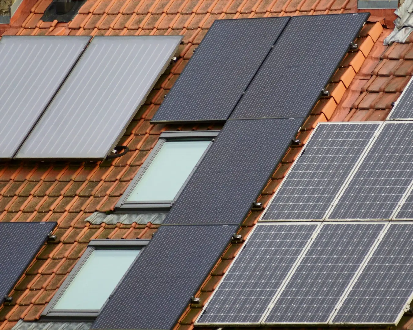 Rooftop solar and skylight systems maintained on a tile roof