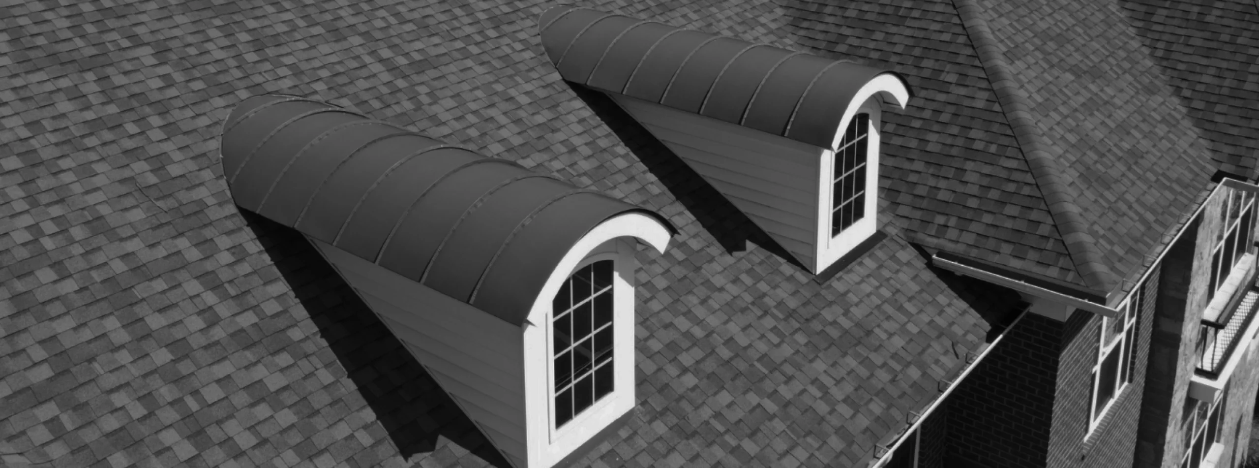 Architectural shingle roof with arched dormer windows